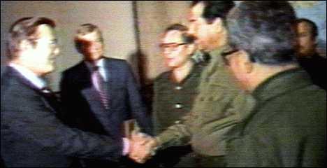 Grainy photo of Donald Rumsfeld shaking hand of Saddam Hussein, 1983