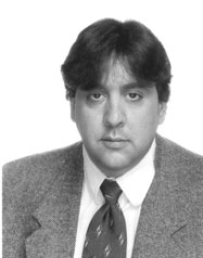 John DiNardo wearing a jacket and tie