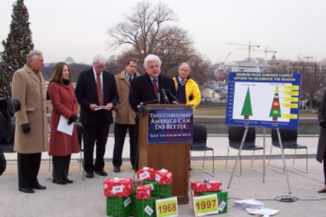 Sen. Ted Kennedy at podium during minimum-wage event, with Rep. Steny Hoyer, CEPR economist Heather Boushey, Rep. Tom Miller, Rep. Sherrod Brown, and Terry Lierman behind